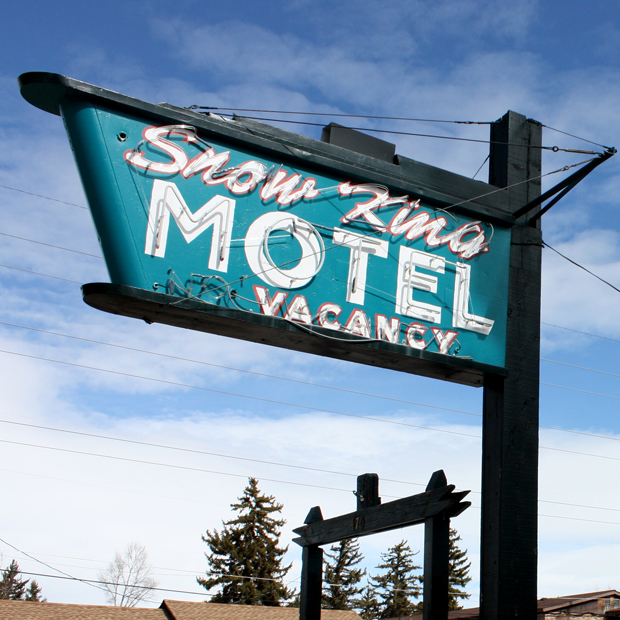Snow King Motel Sign Photograph by Borbay